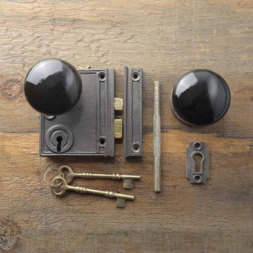 Vertcal cast iron rim lock with black porcelain knob