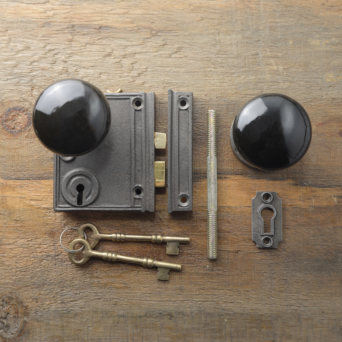 Vertcal cast iron rim lock with black porcelain knob
