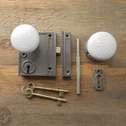 Vertcal cast iron rim lock with white cracked porcelain knob